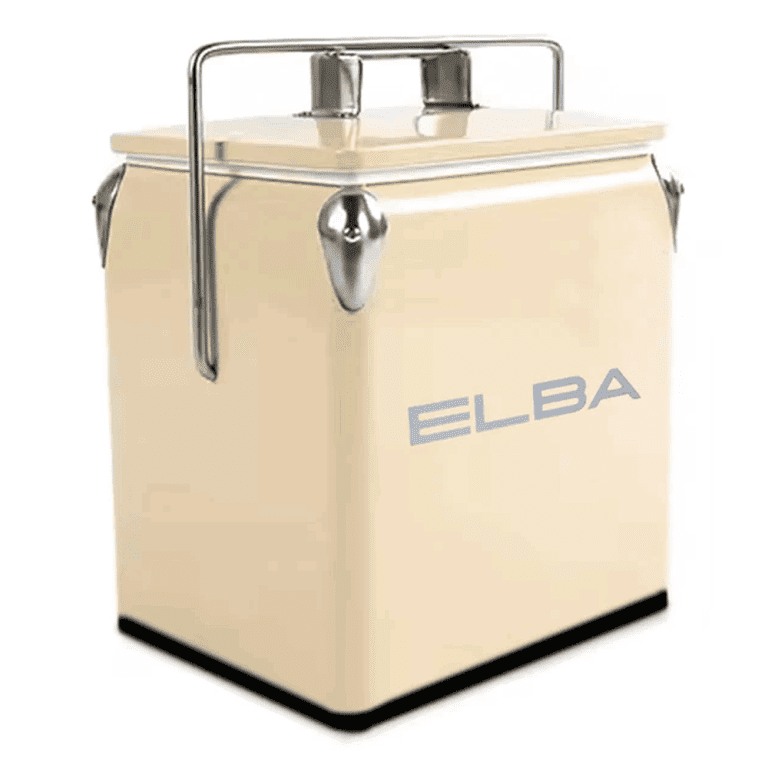 The Elba Retro Metal Cooler Box in elegant cream, with its handle upright, in an outdoor or picnic setting.