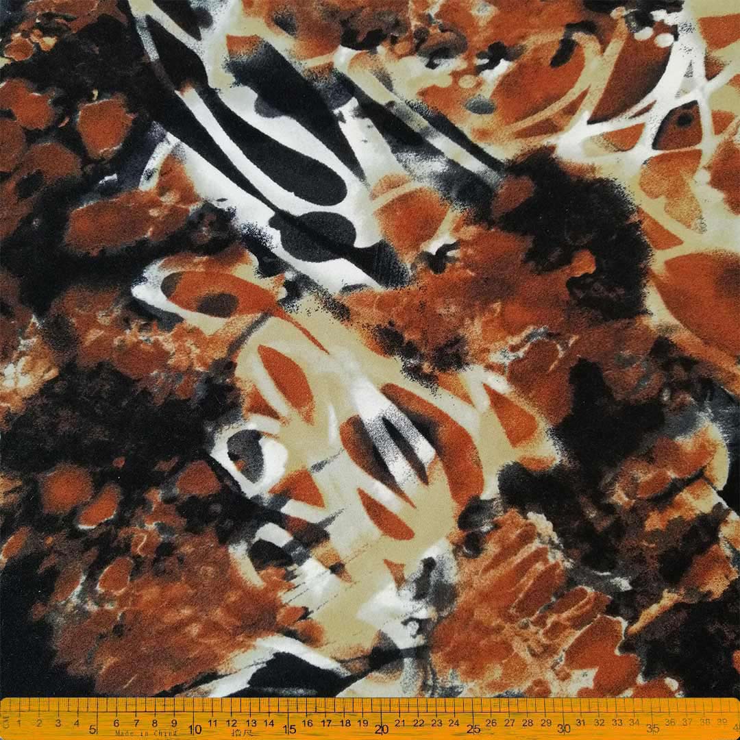 Scuba Crepe Burnt Red Abstract Printed – Bold burnt red fabric with abstract print, perfect for creating stylish garments, home décor, and accessories, offering elegance and modern flair with lasting durability.