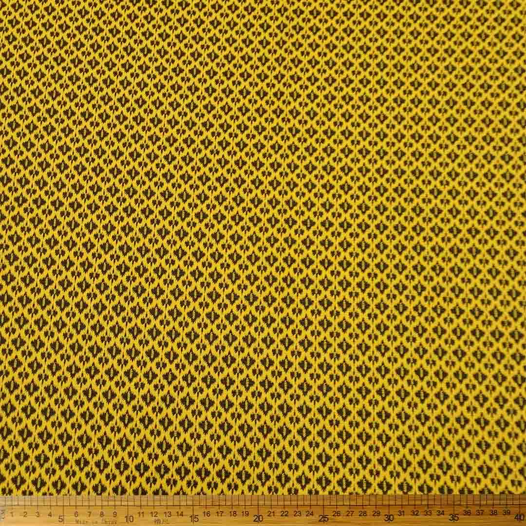 Knitted Jacquard Ethnic Mustard 13512 fabric with a detailed ethnic pattern in mustard, ideal for fashion and home decor projects.