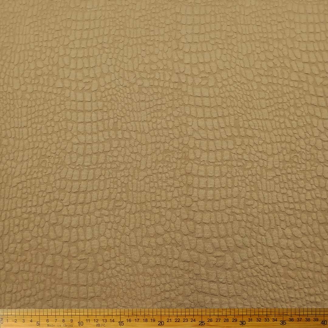 Knitted Jacquard Bubble Sand 15306/052 fabric with bubble texture and warm sand color, perfect for home décor, fashion, and upholstery projects.